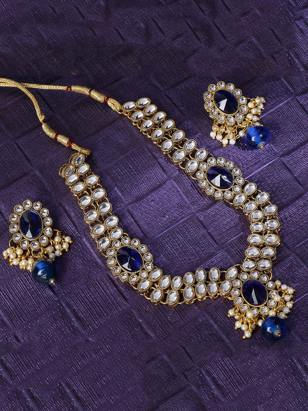 

LIVE EVIL Blue & Gold-Plated Kundan Studded Jewellery Set