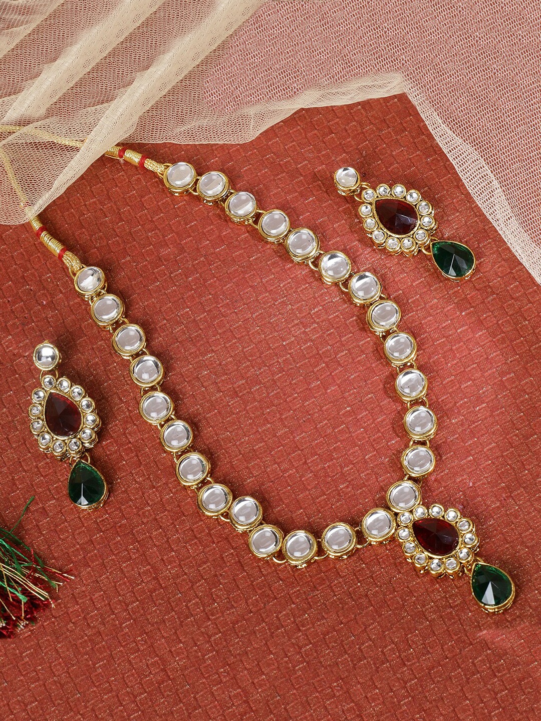 

LIVE EVIL Red & Green Kundan Gold-Plated Jewellery Set