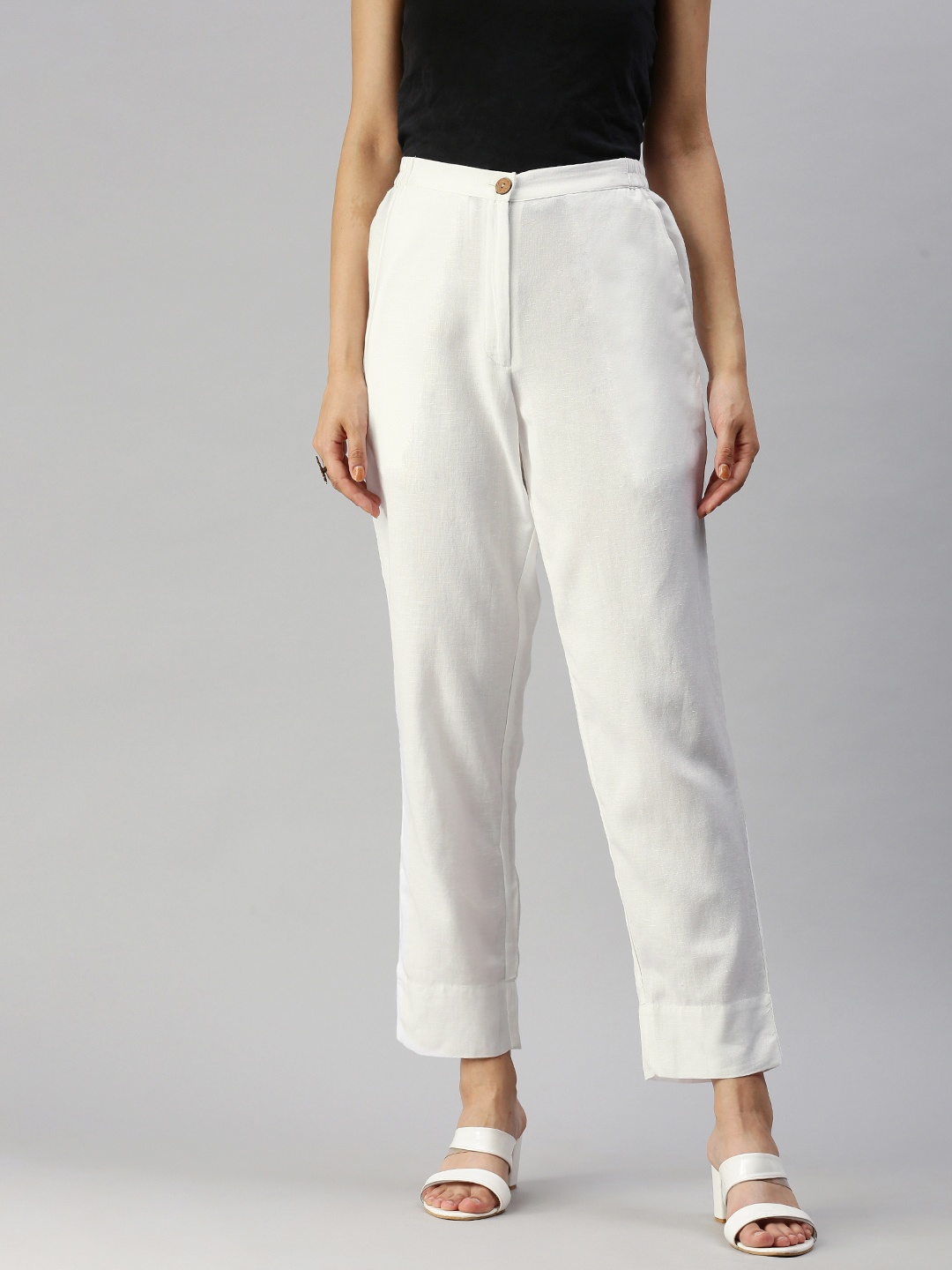 

Global Desi Women White Solid Straight Fit Trousers