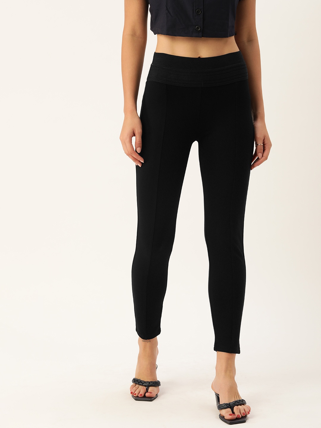 

AND Women Black Solid Mid-Rise Tapered Fit Trousers