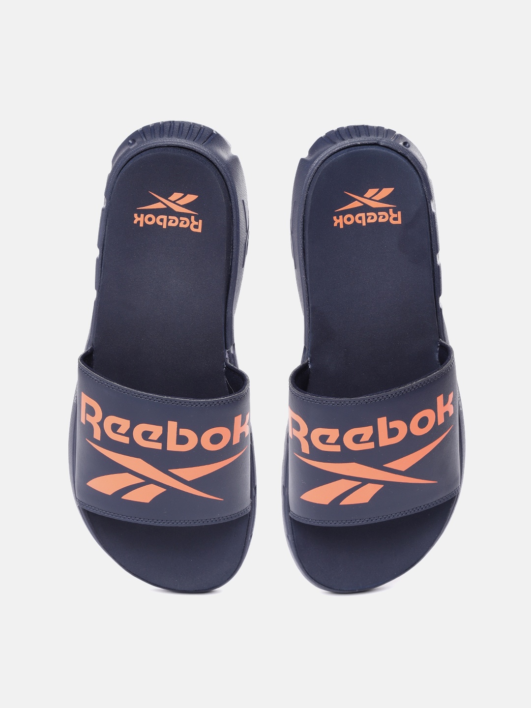 

Reebok Men Navy Blue & Orange Brand Logo Printed Sliders