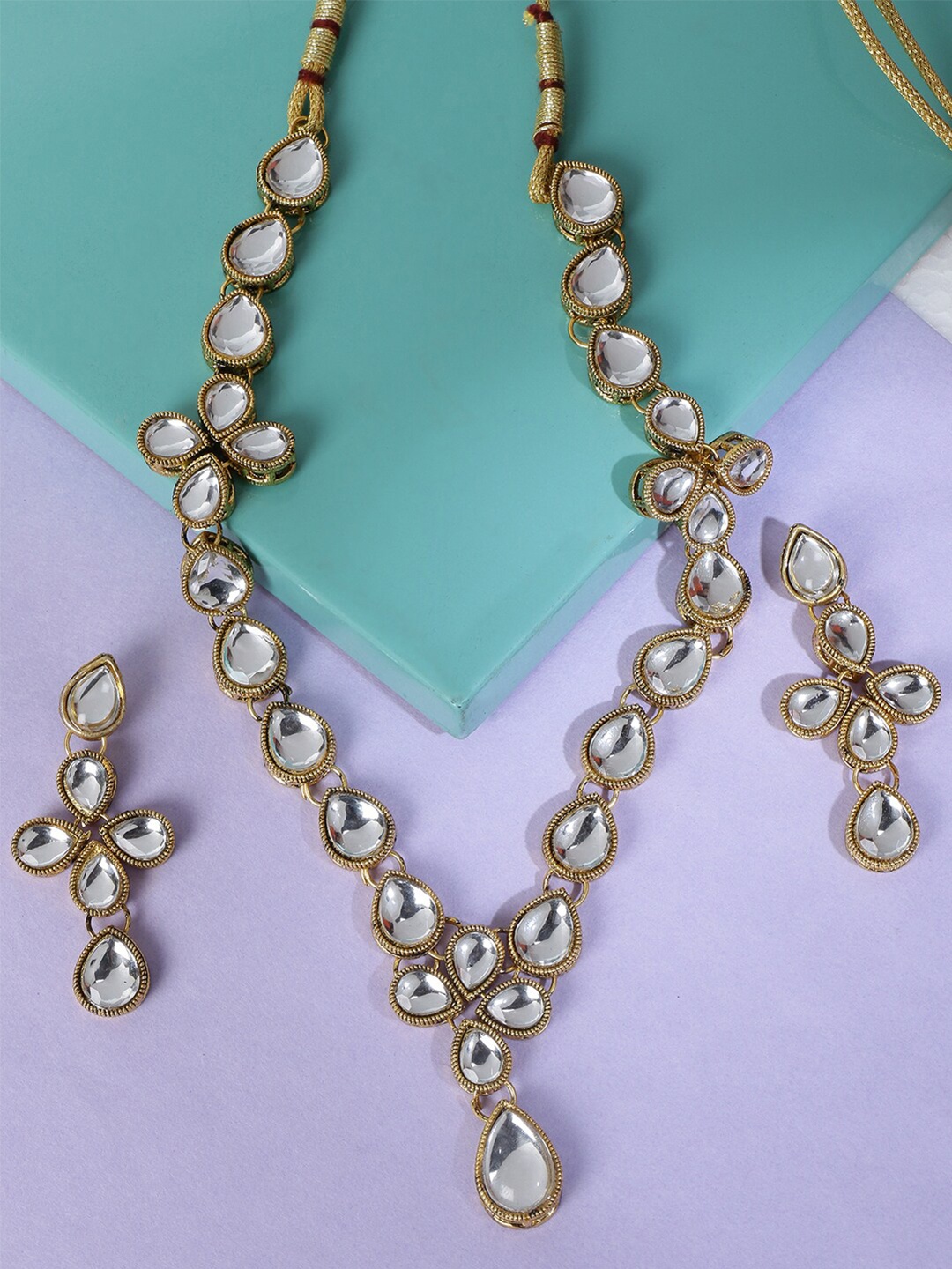 

LIVE EVIL Transparent & Gold-Plated Kundan Studded Jewellery Set