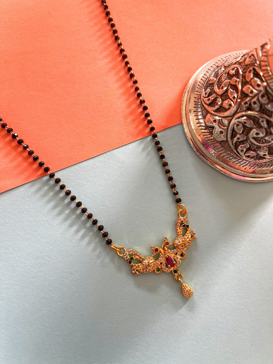 

Digital Dress Room Gold-Plated & Red Stones-Studded & Beaded Mangalsutra