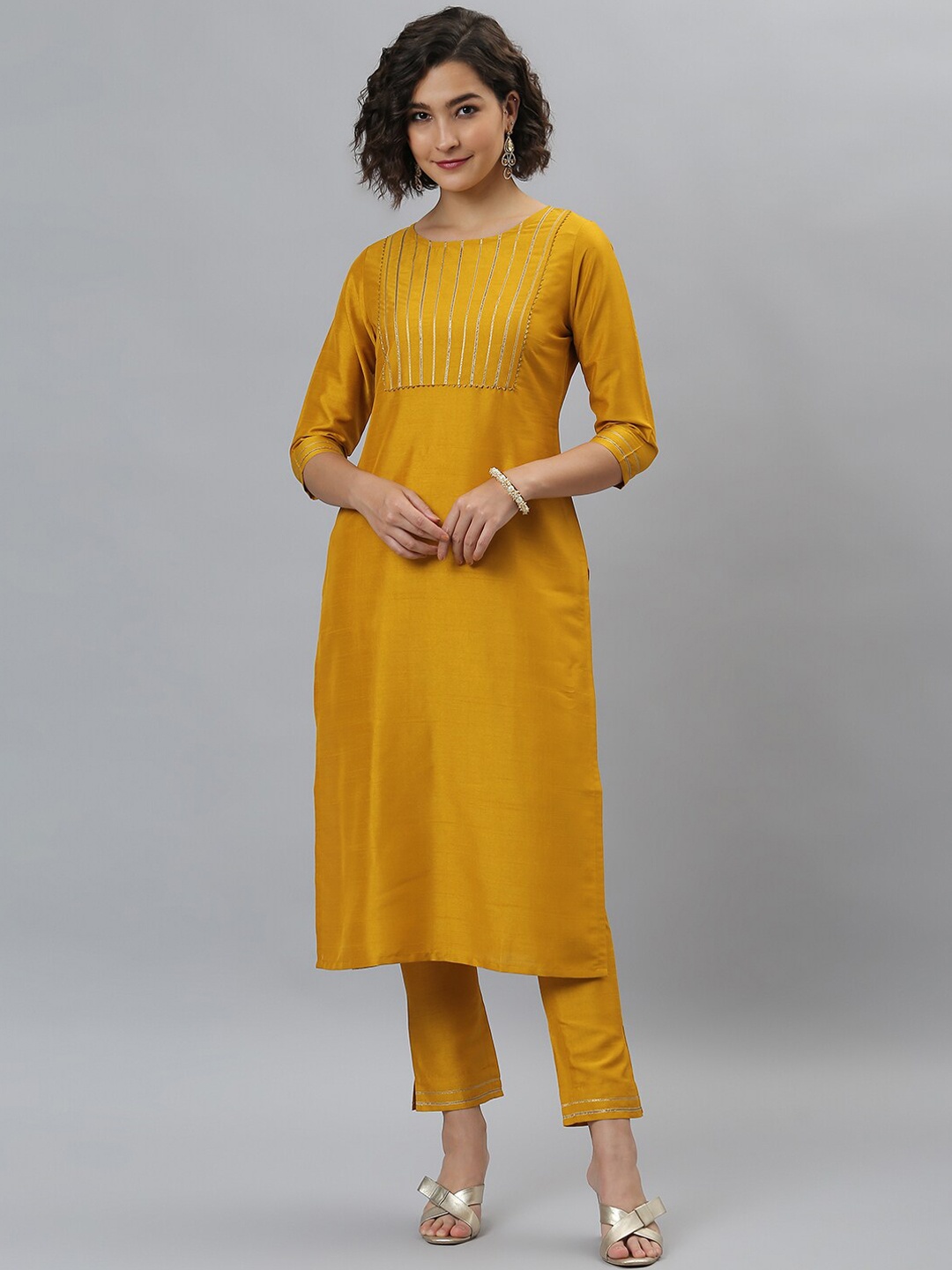 

Janasya Women Mustard Yellow Yoke Design Gotta Patti Kurta with Trousers