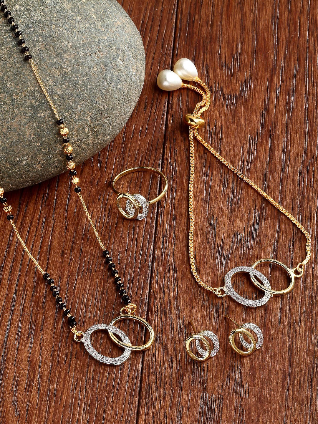 

ZENEME Gold-Plated & White AD-Studded & Beaded Oval Shaped Mangalsutra