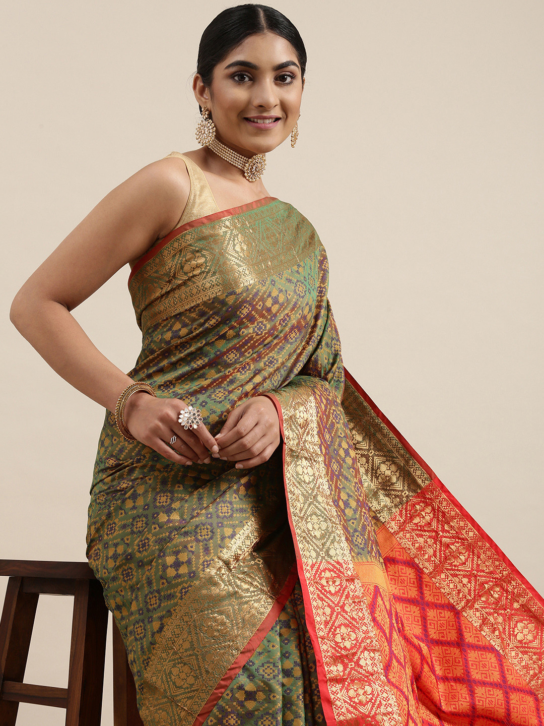 

Mitera Olive Green & Beige Woven Design Zari Patola Silk Saree