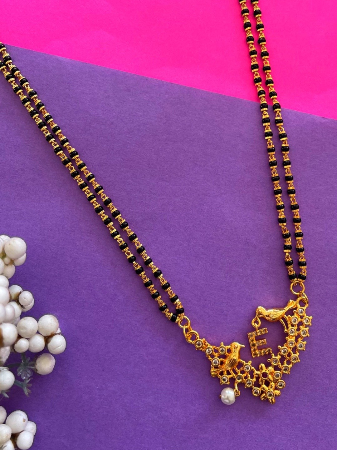 

Digital Dress Room Gold-Plated Black & White Beaded & Stone-Studded E-Alphabet Mangalsutra