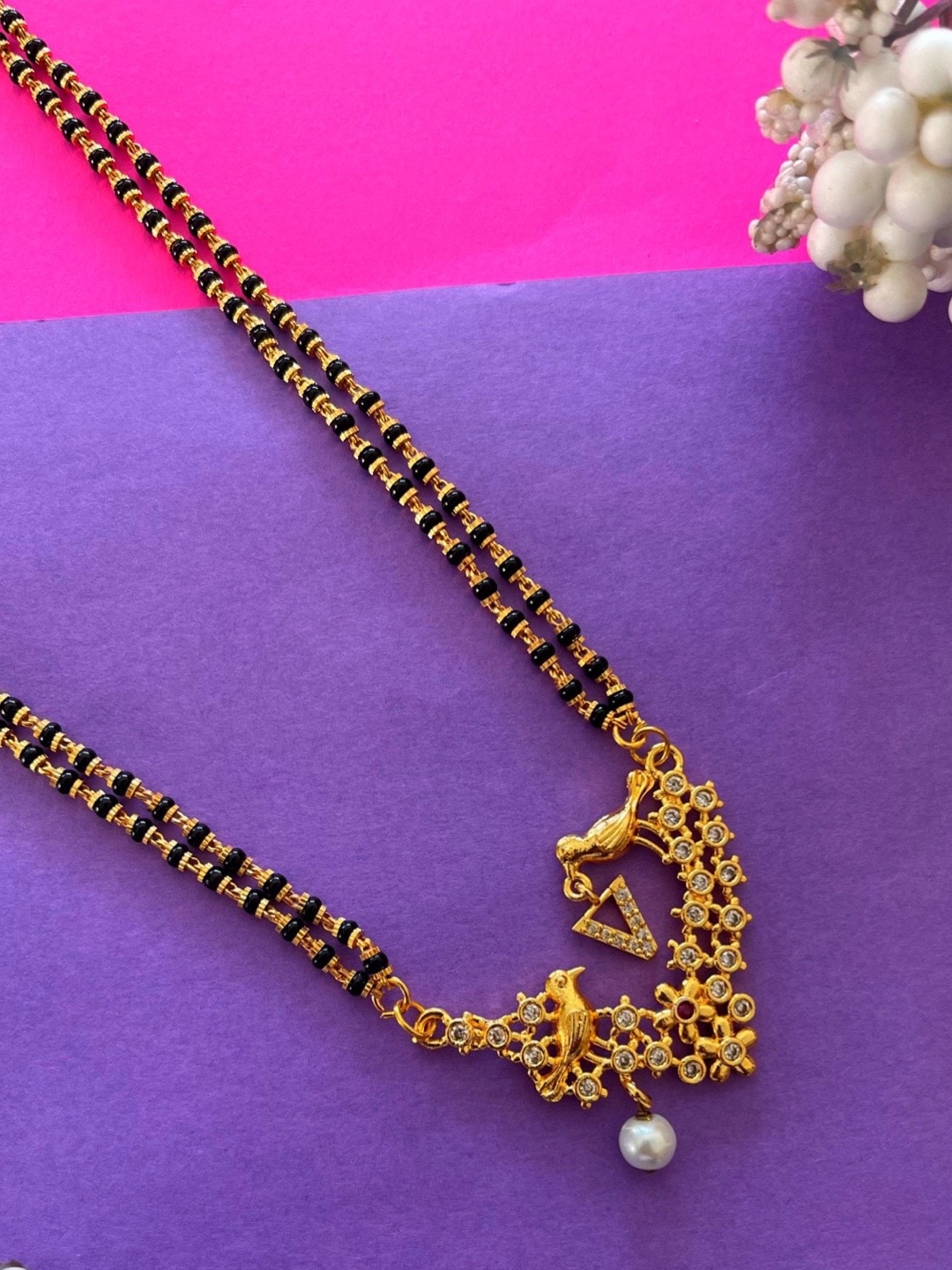 

Digital Dress Room Gold-Plated Black & White Beaded & Stone-Studded V-Alphabet Mangalsutra