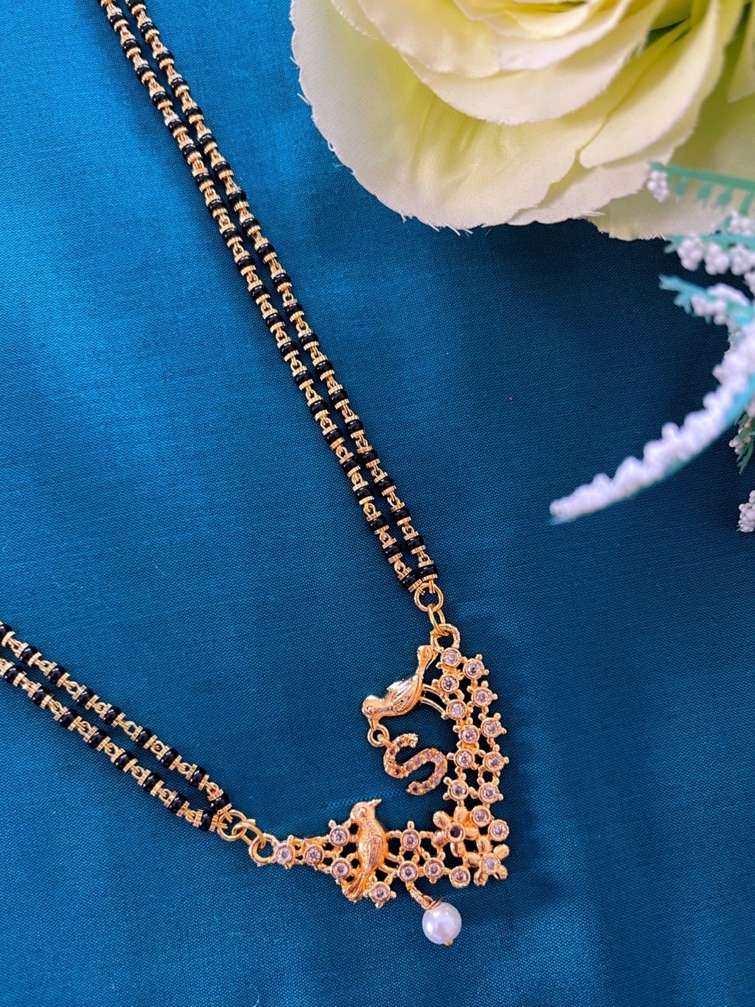 

Digital Dress Room Gold-Plated Black & White Beaded & Stone-Studded Mangalsutra