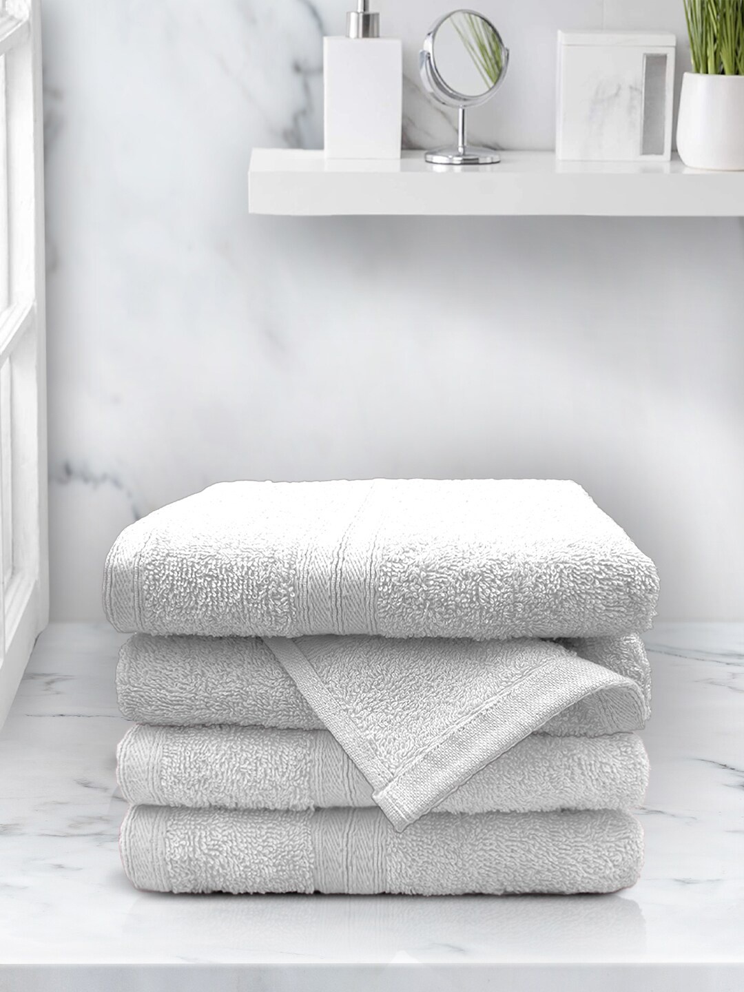 

Aura Set Of 4 White Solid 500 GSM Cotton Hand Towels