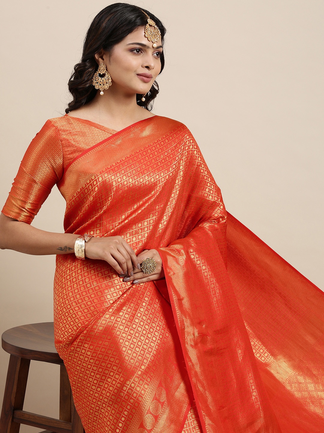 

Mitera Orange & Golden Ethnic Motifs Saree with Zari Work