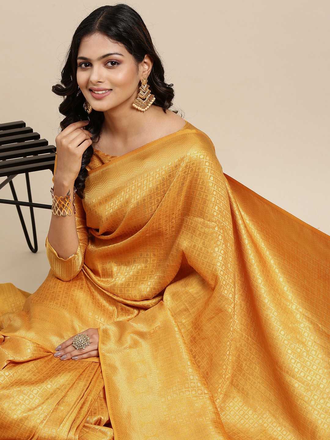 

Mitera Yellow & Golden Ethnic Motifs Saree with Zari Work