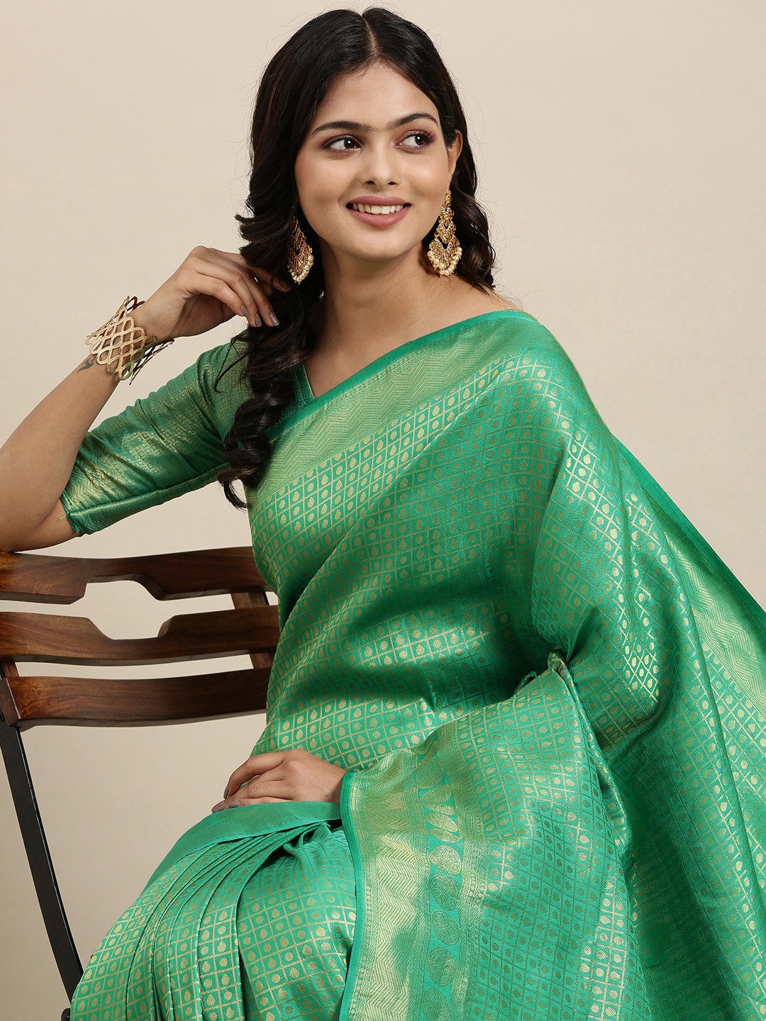 

Mitera Green & Golden Ethnic Motifs Saree with Zari Work