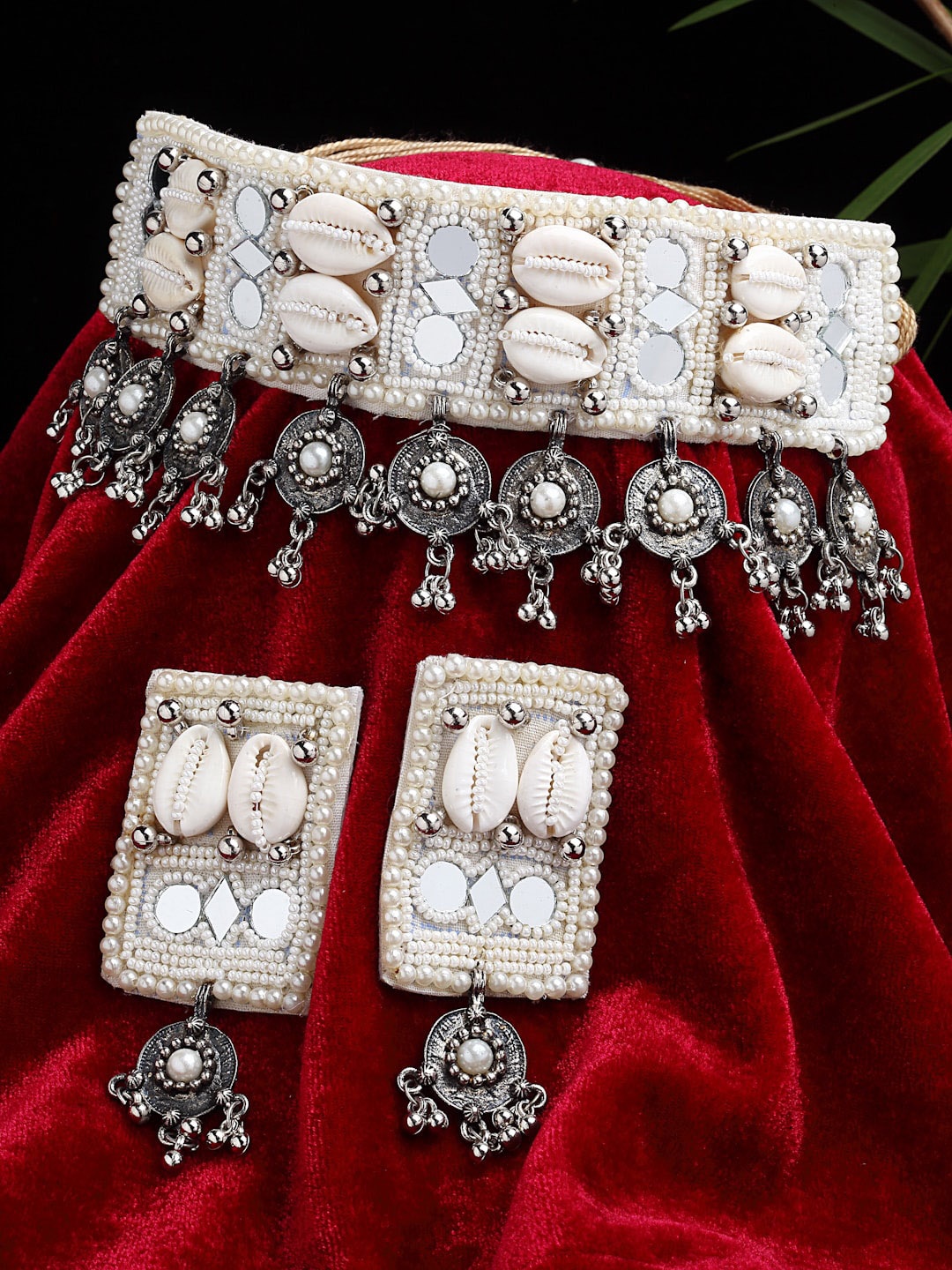 

Sargi Silver-Plated Off White Mirrors & Cowri Studded Tasselled Design Jewellery Set