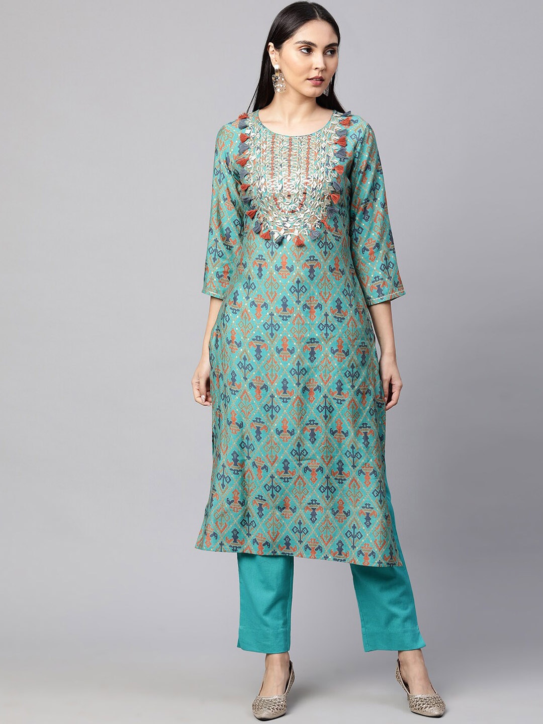 

FASHOR Women Turquoise Blue Ethnic Motifs Printed Thread Work Kurta with Trousers