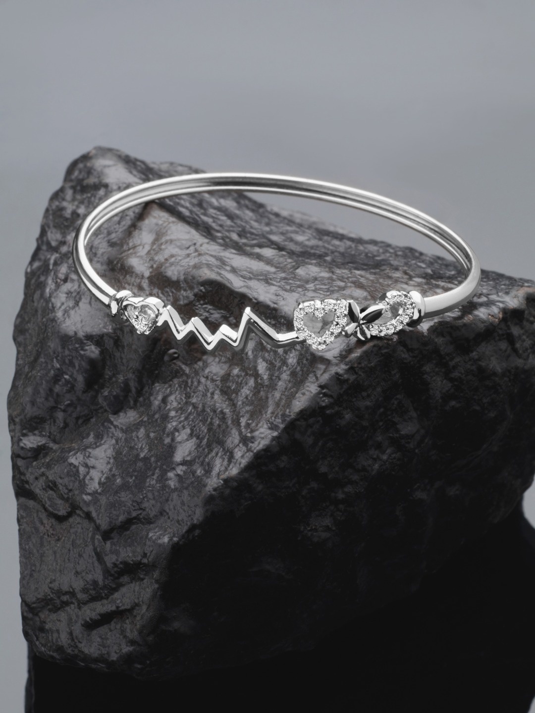 

AMI Women Silver-Toned Cubic Zirconia Studded Heart Beat Bangle Style Kada Bracelet