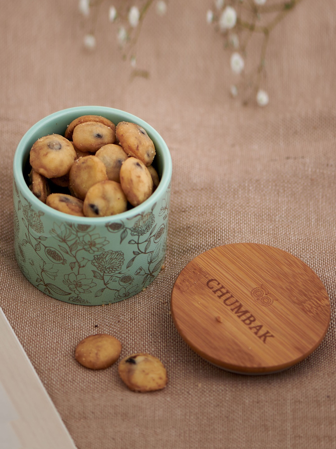 

Chumbak Sea-Green & Brown Ceramic Storage Jar With Wooden Lid