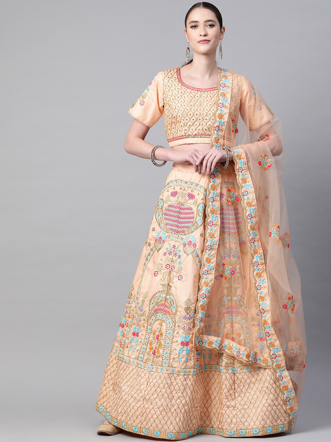 

Readiprint Fashions Peach-Coloured & Pink Embroidered Thread Work Semi-Stitched Lehenga & Unstitched Blouse