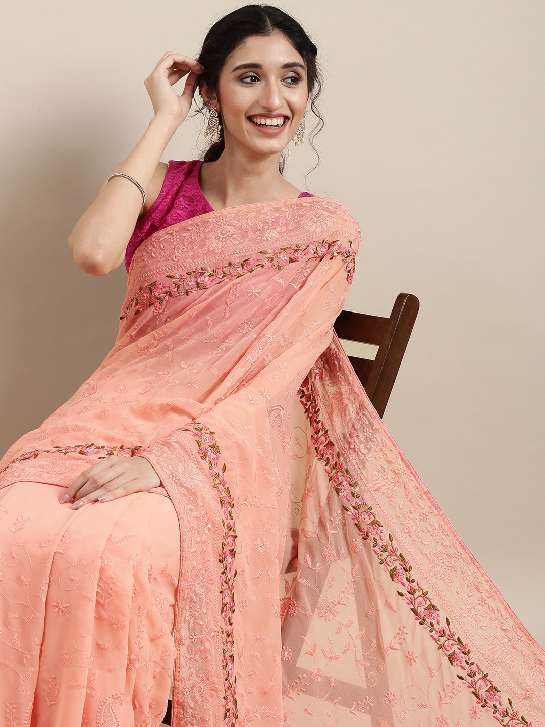 

VASTRANAND Peach-Coloured Ethnic Motifs Embroidered Saree