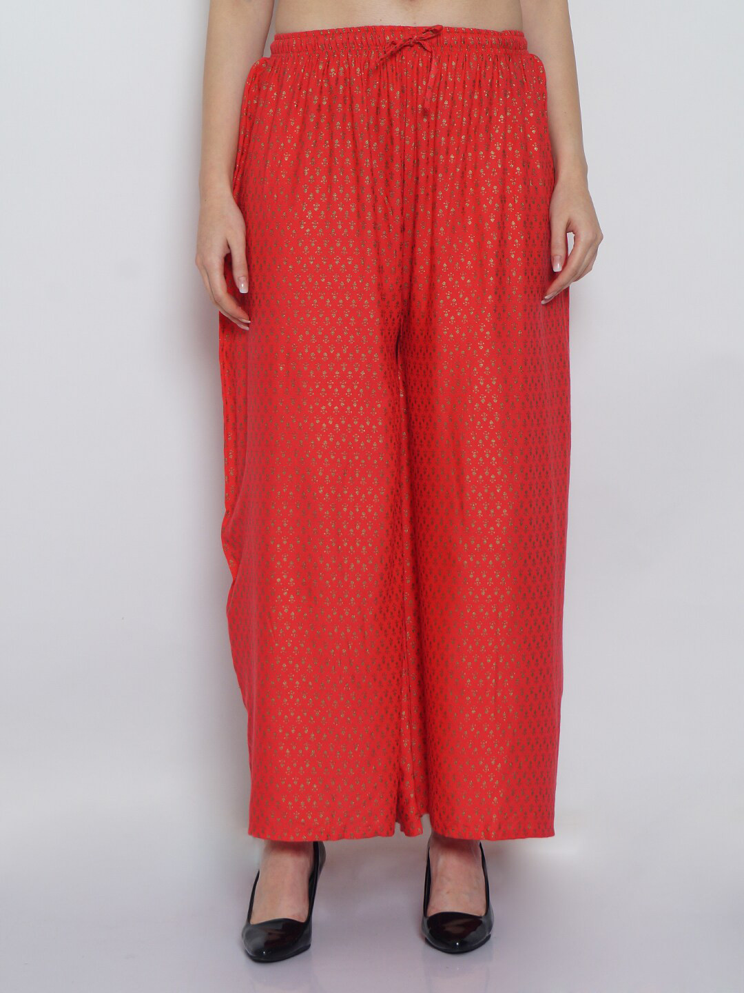 

GRACIT Women Orange & Gold-Toned Ethnic Motifs Printed Palazzos