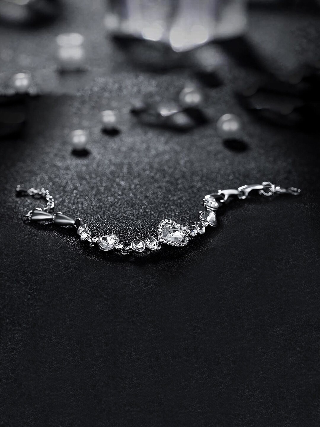 

Yellow Chimes Women White Crystal Studded Heart Designed Charm Bracelet