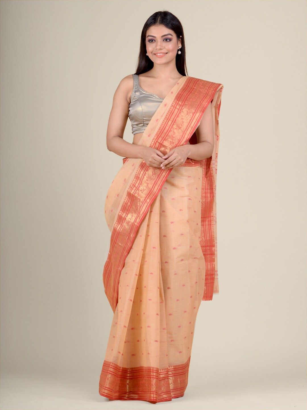 

Charukriti Beige & Orange Ethnic Motifs Pure Cotton Taant Saree