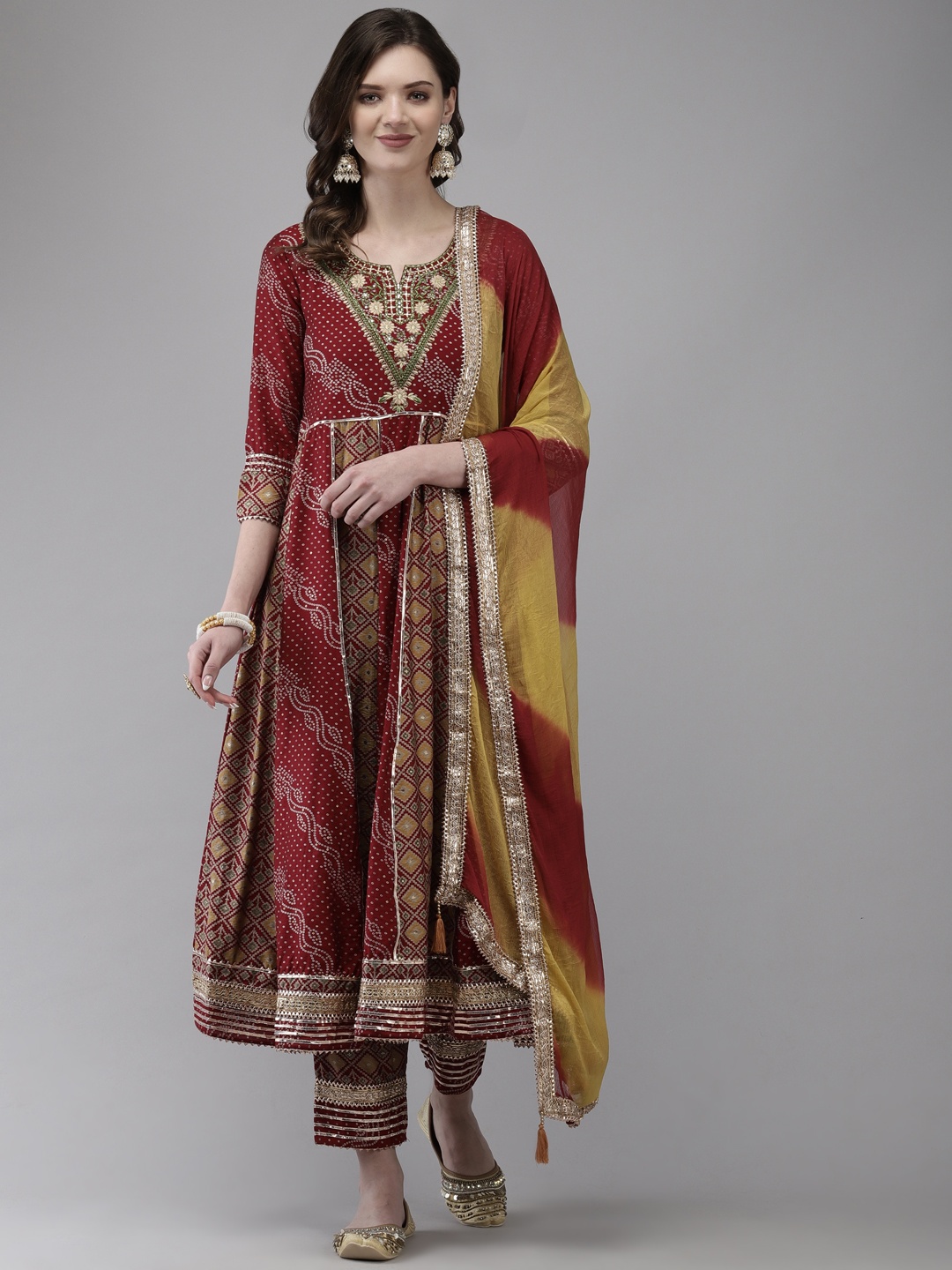 

Ishin Women Maroon Bandhani Embroidered Gotta Patti Kurta with Trousers & With Dupatta