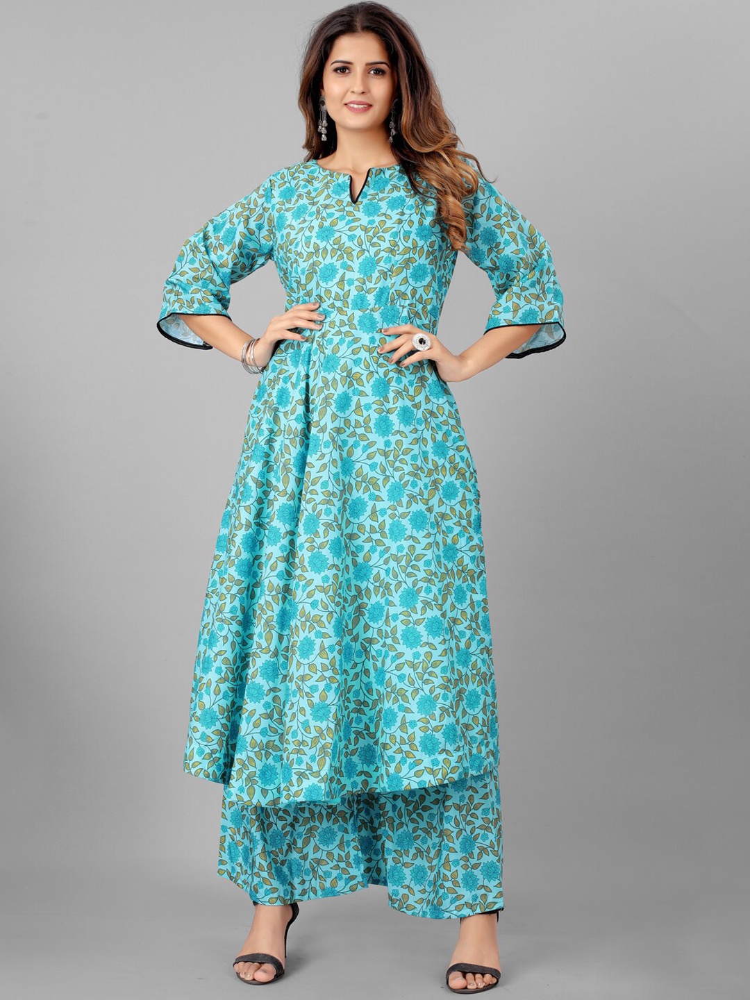 

SHOPGARB Women Turquoise Blue Floral Printed A-Line Kurta with Palazzos
