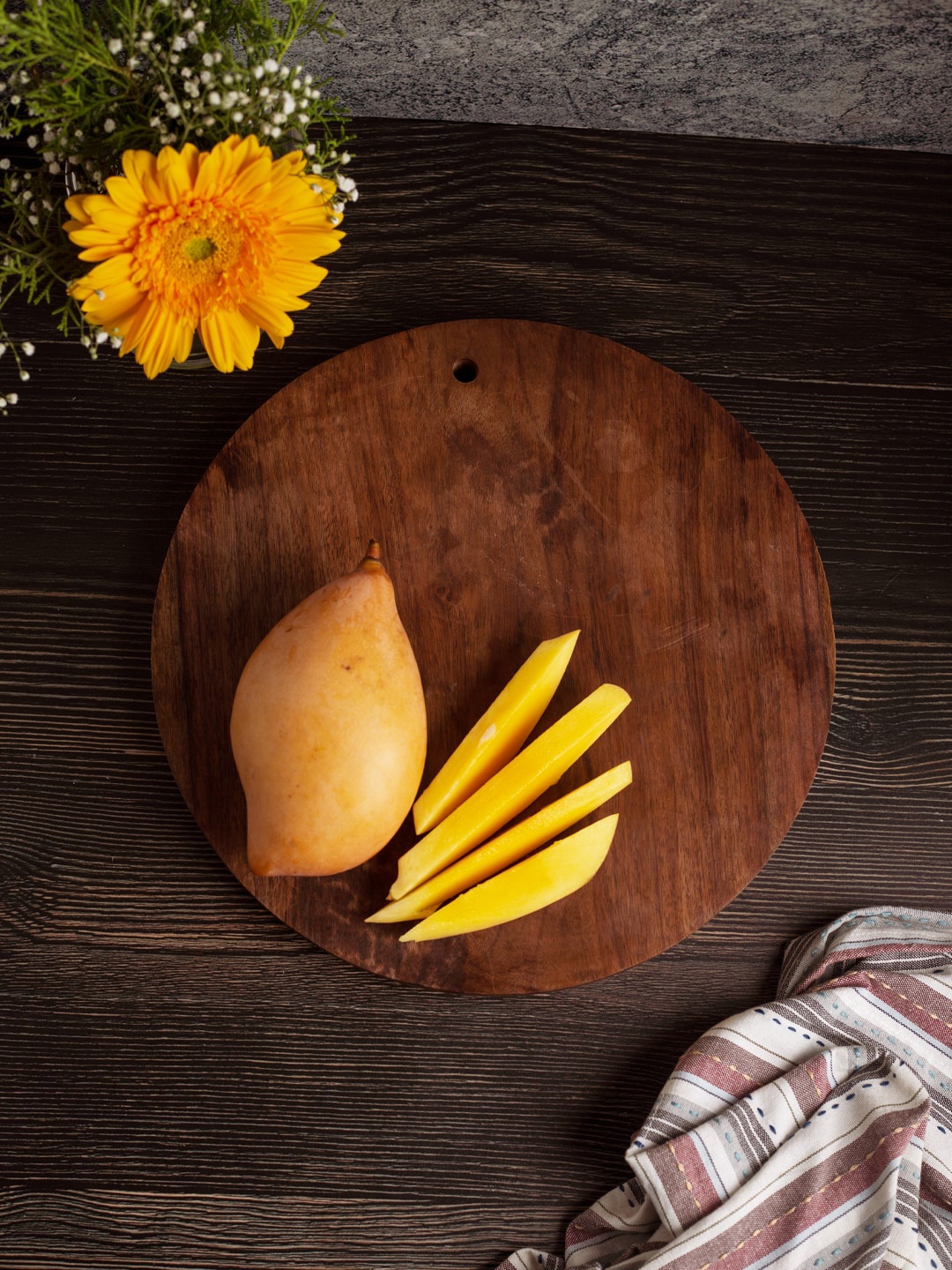 

The Indus Valley Brown Palm Wooden Reversible Circular Chopping Board 25 cm