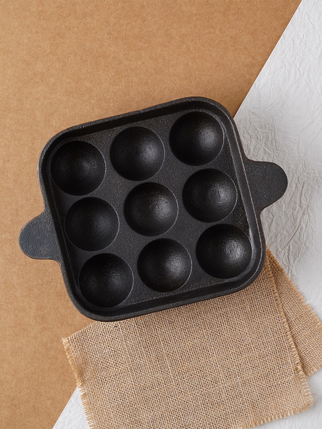 

The Indus Valley Black Pre Seasoned Super Smooth Cast Iron Paniyaram/Paddu Pan