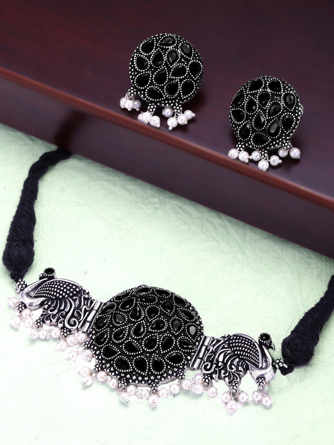 

Yellow Chimes Oxidised Silver-Plated Black Stones-Studded & Beaded Jewellery Set