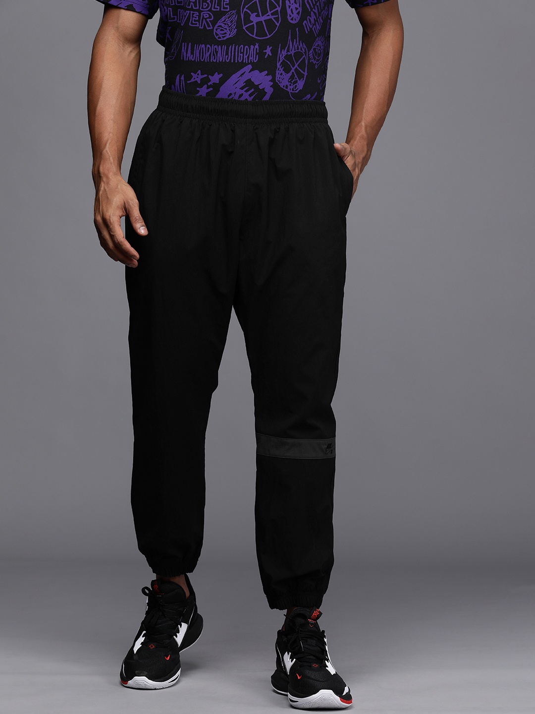 

Nike Men Black Brand Logo Print Mid Rise Dry Fit Casual Joggers