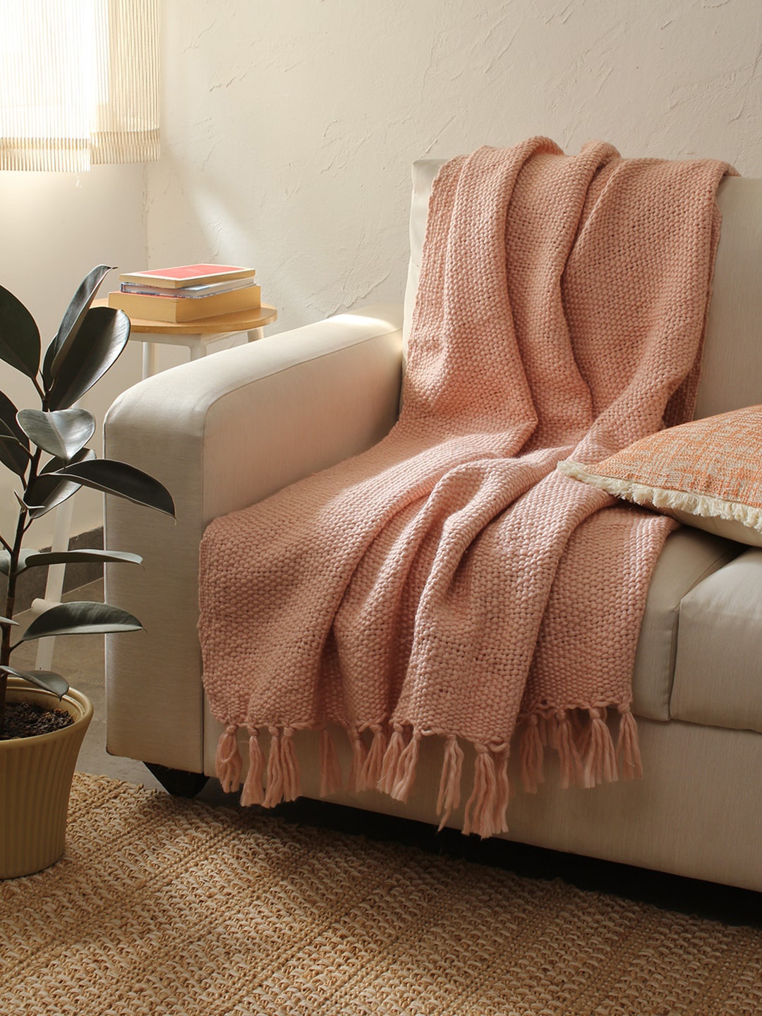 

House This Peach-Coloured Self-Design Sofa Throw