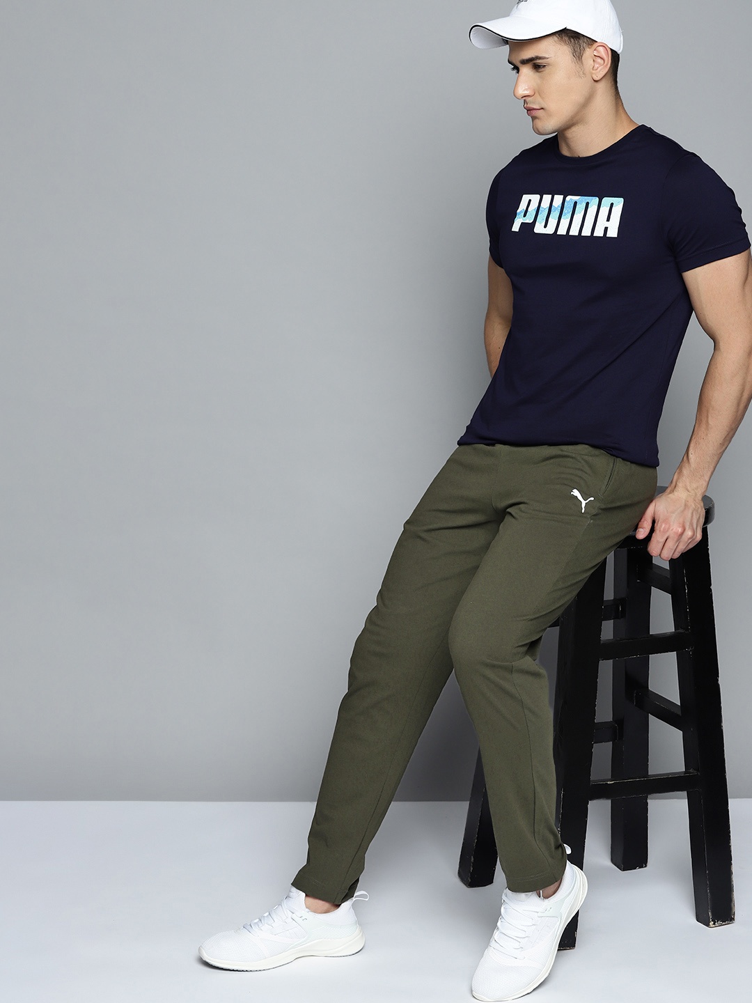 

Puma Men Olive Green Brand Logo Printed Regular Fit Mid Rise Zipper Knitted Track Pants
