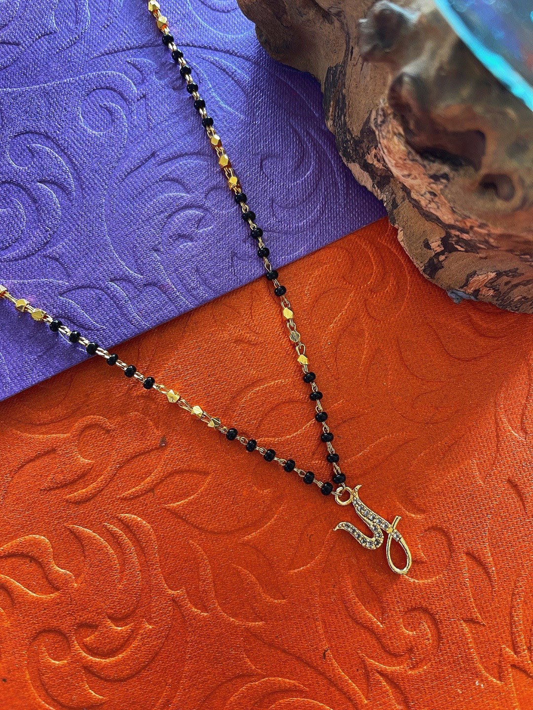 

Digital Dress Room Gold-Plated White & Black Stone-Studded & Beaded Y-Shaped Mangalsutra