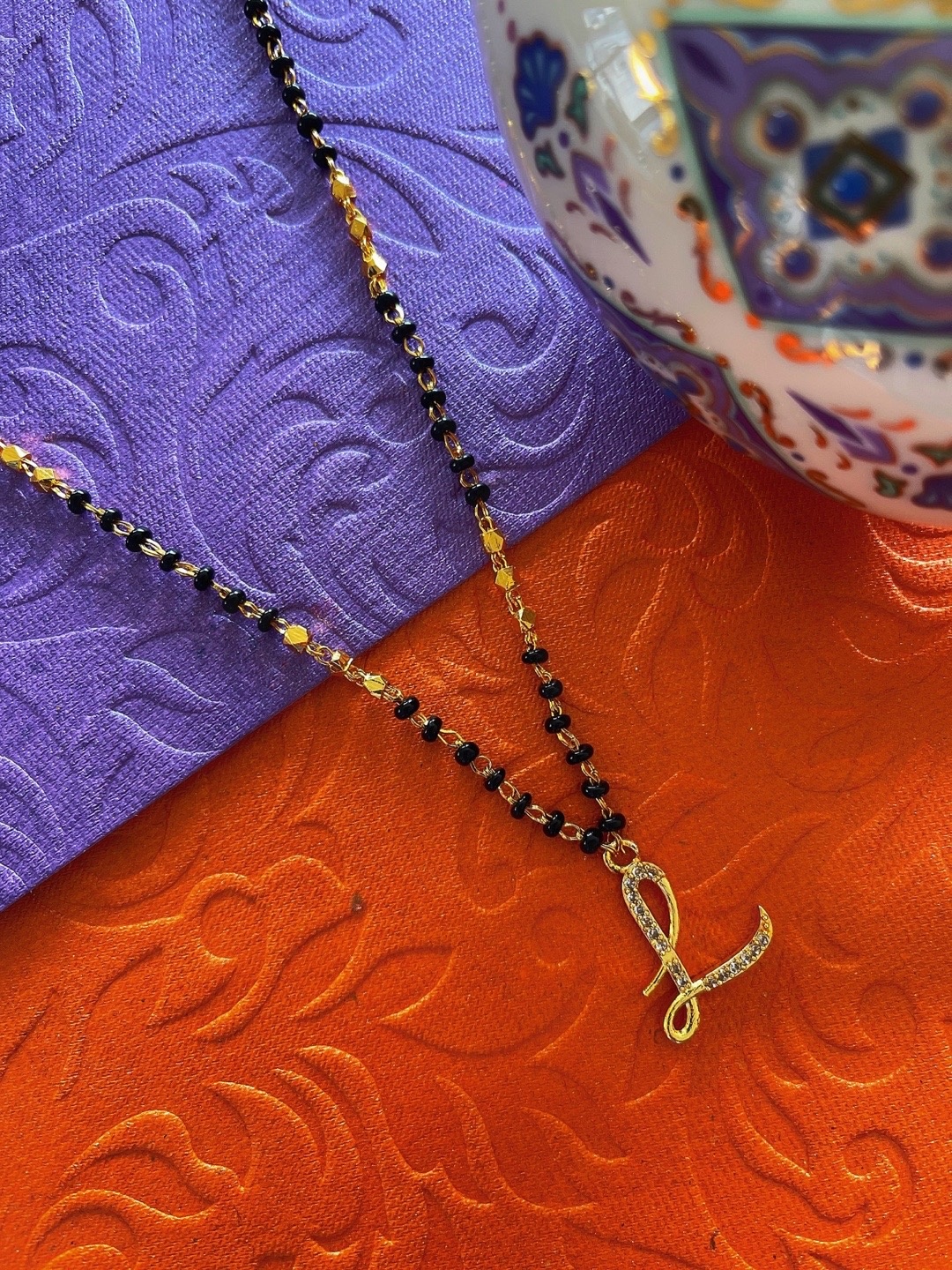 

Digital Dress Room Gold-Plated L Letter Black Beaded Mangalsutra