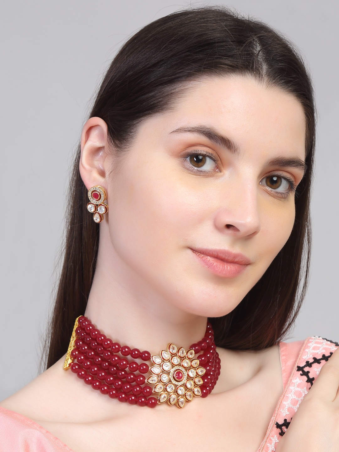 

Yellow Chimes Gold-plated Red Kundan Studded Beaded Jewellery Set
