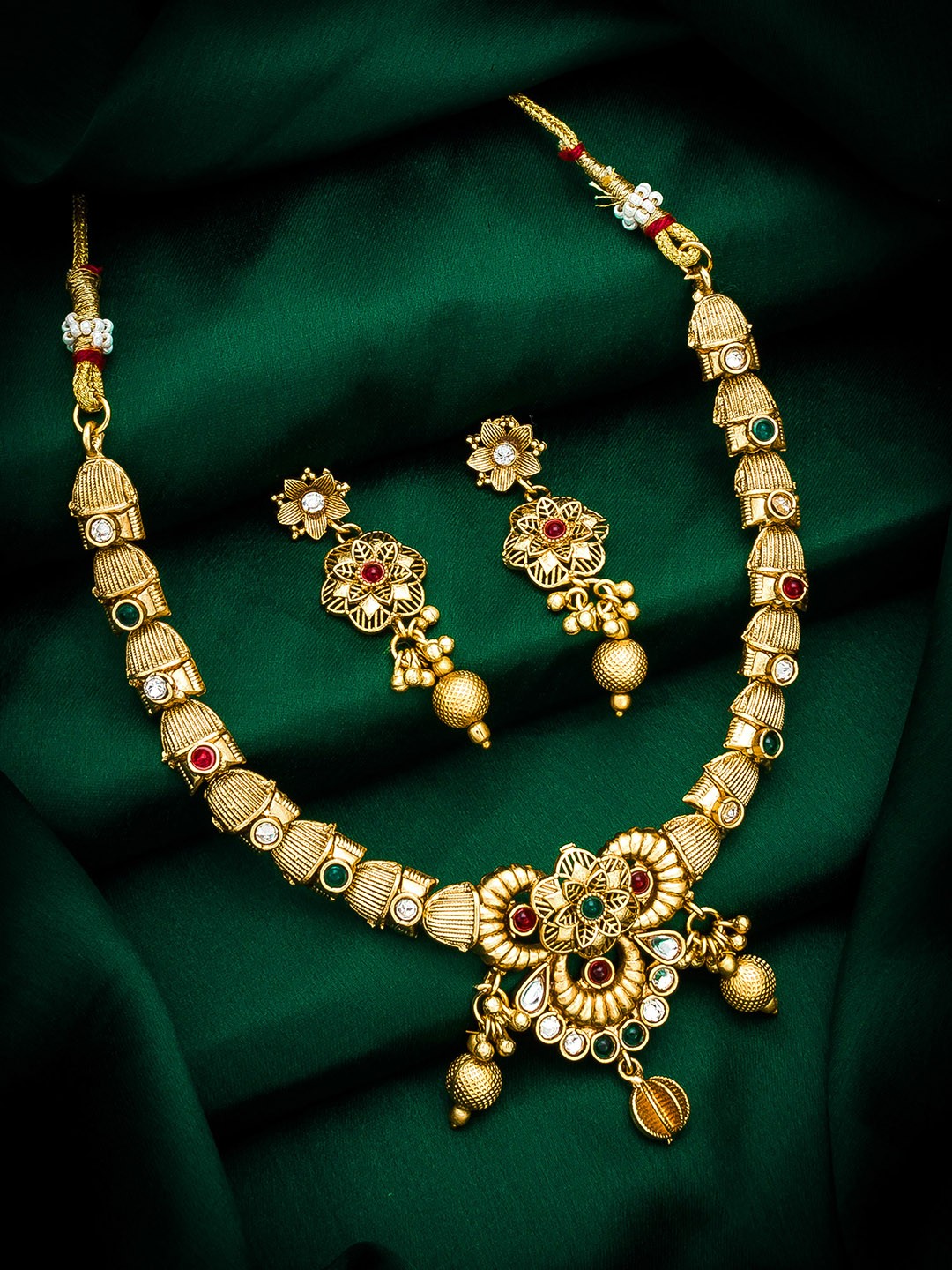 

aadita Gold Plated & Red Studded Jewellery Set