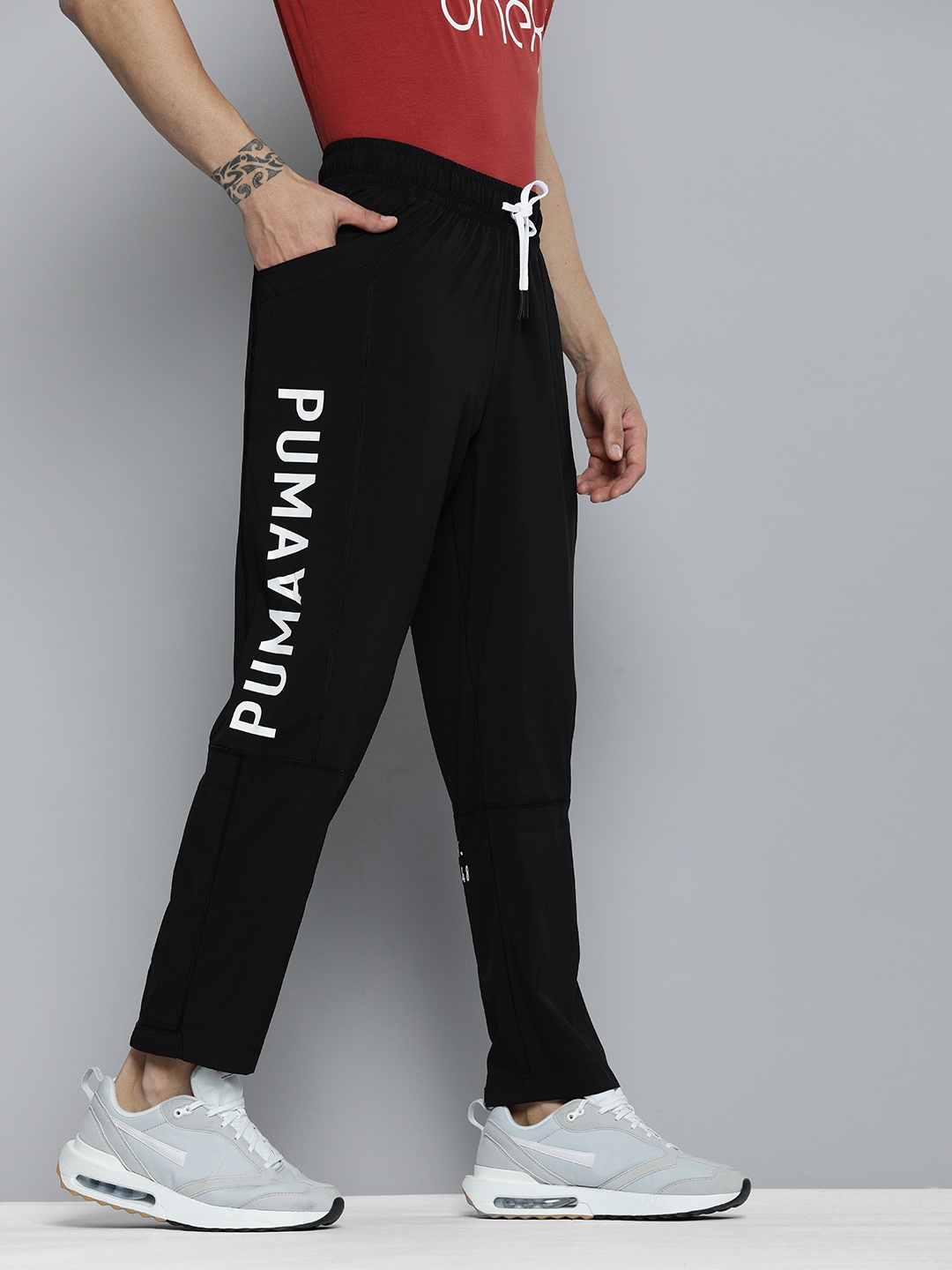 

Men Black & White Logo Woven Printed Training Sustainable Sustainable Track Pant