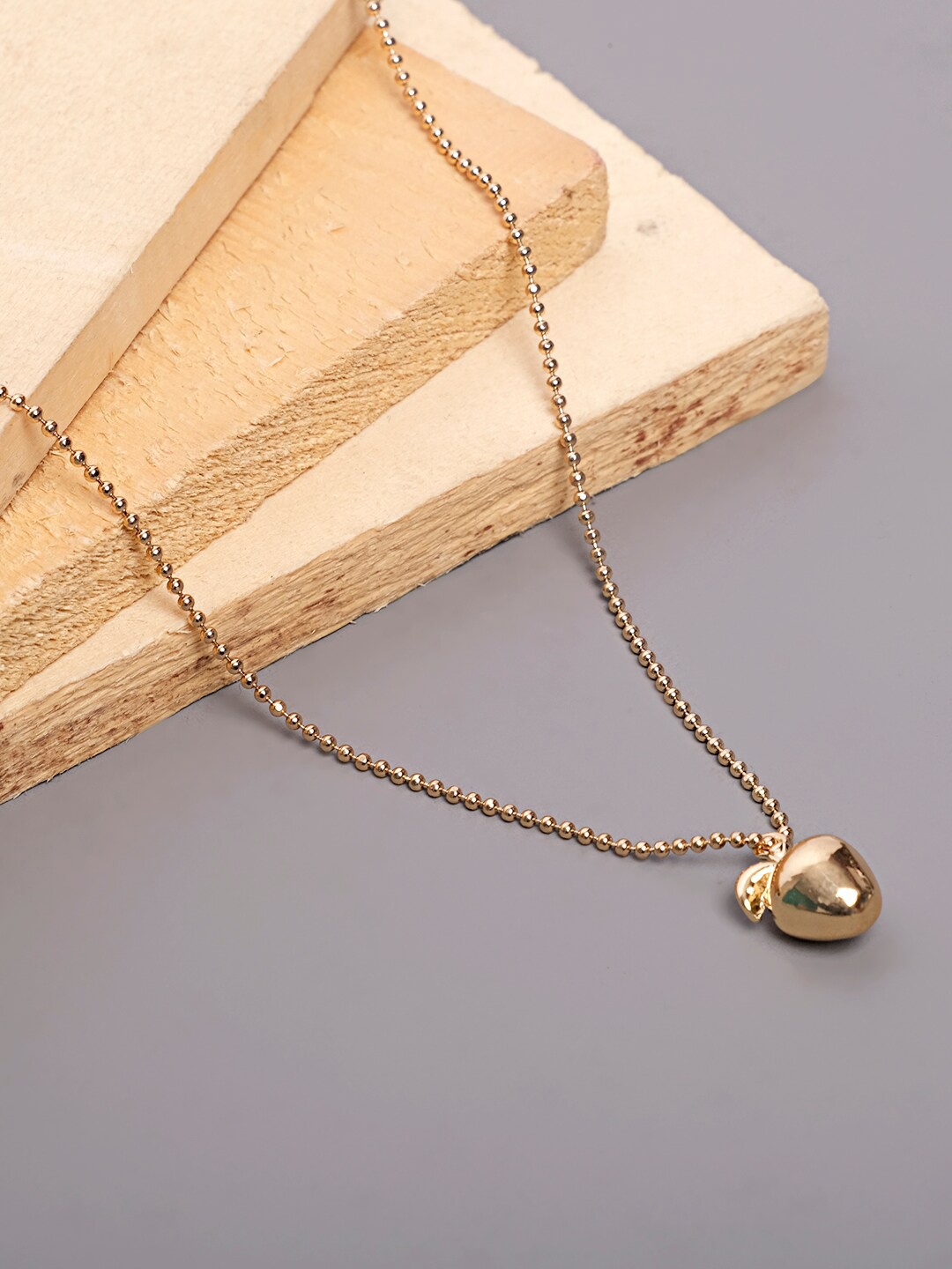 

Lilly & sparkle Gold-Plated Necklace With Golden Apple Pendant