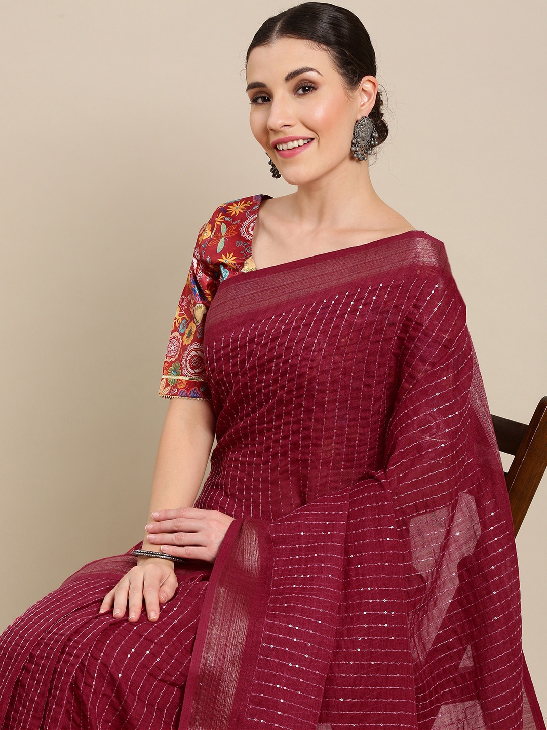 

Kvsfab Women Maroon Striped Sequinned Saree