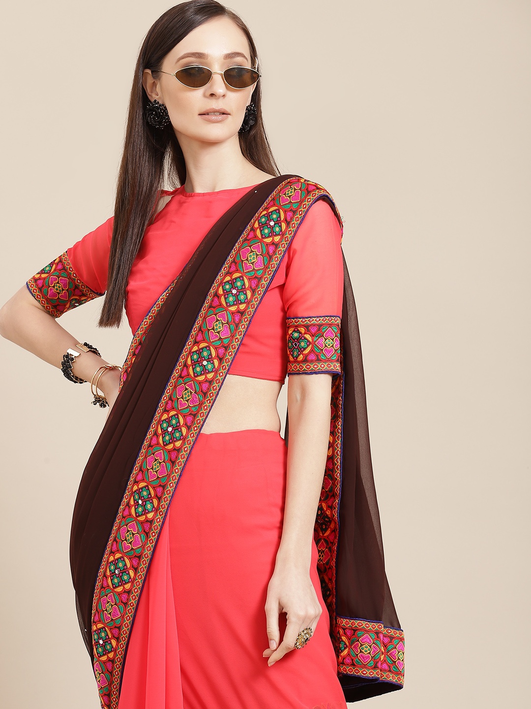 

Mitera Coral Ethnic Motifs Embroidered Pure Georgette Saree