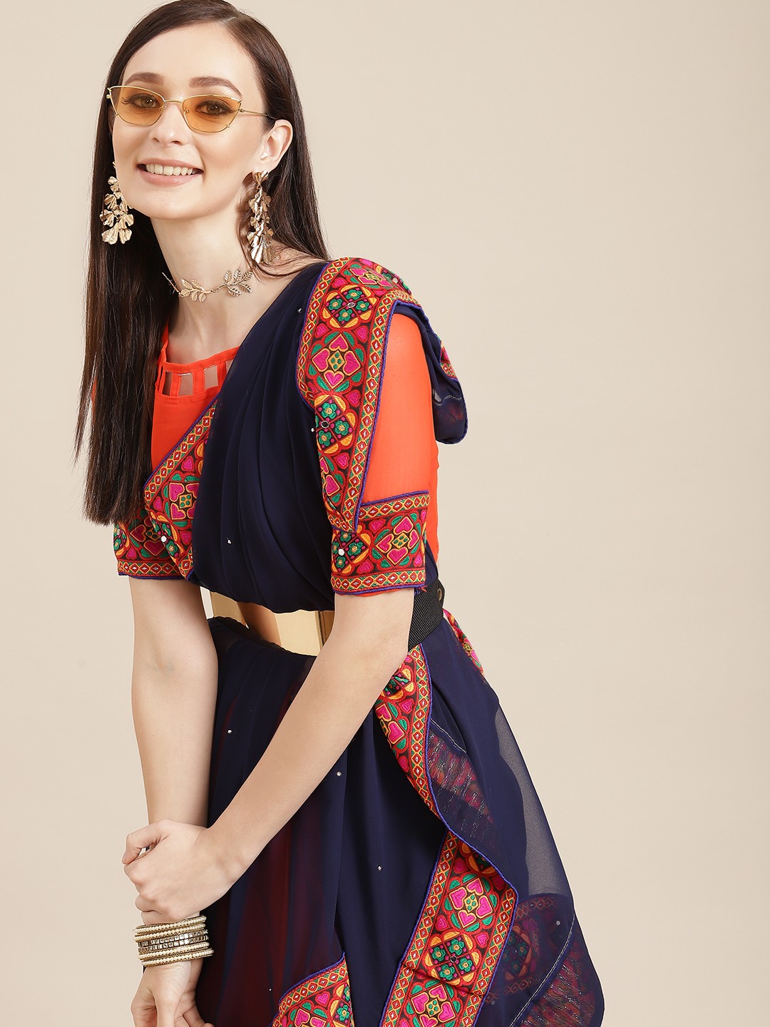 

Mitera Navy Blue & Orange Ethnic Motifs Embroidered Pure Georgette Saree