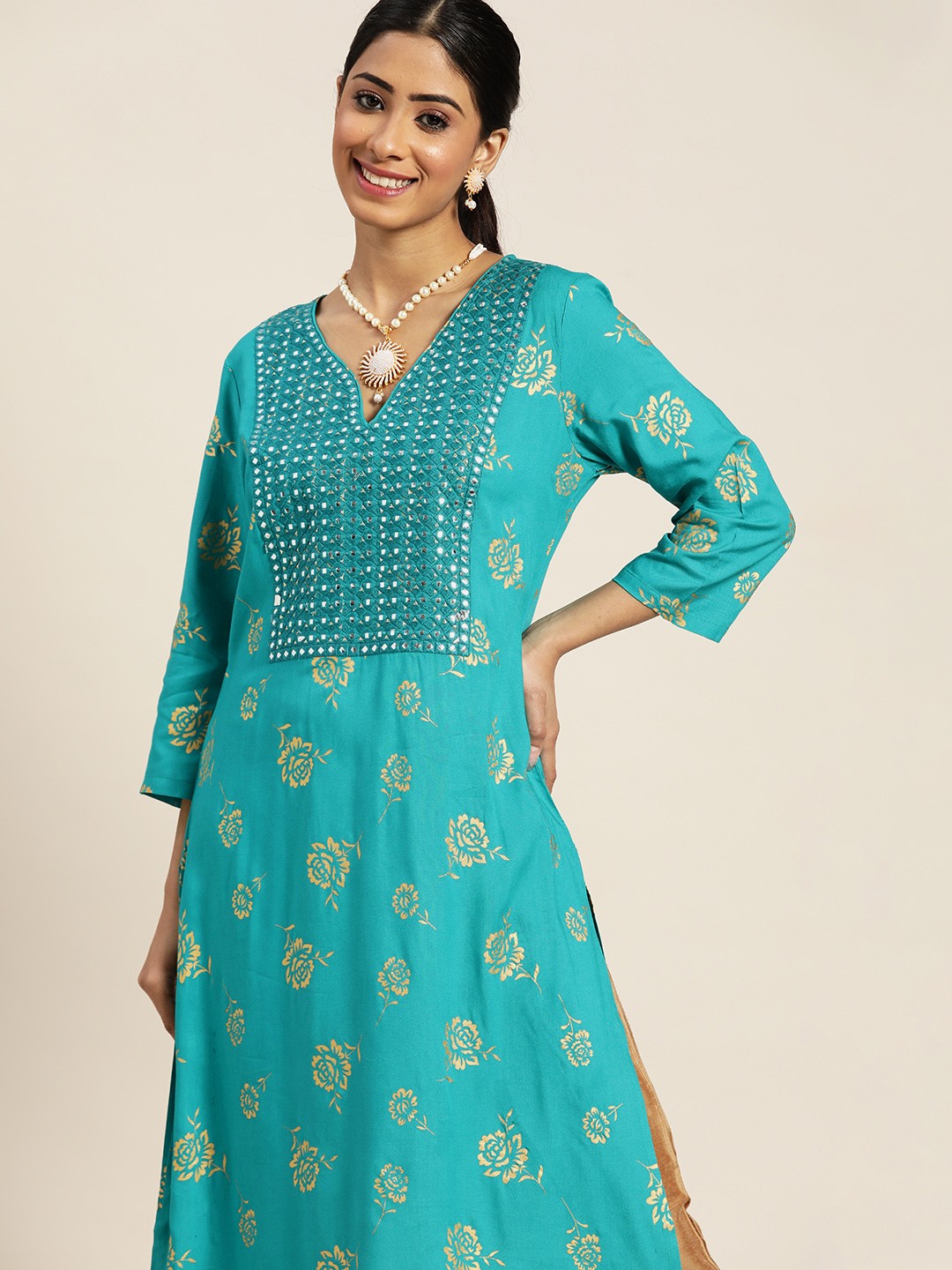 

Sangria Women Turquoise Blue & Golden Floral Embroidered Mirror Work Kurta