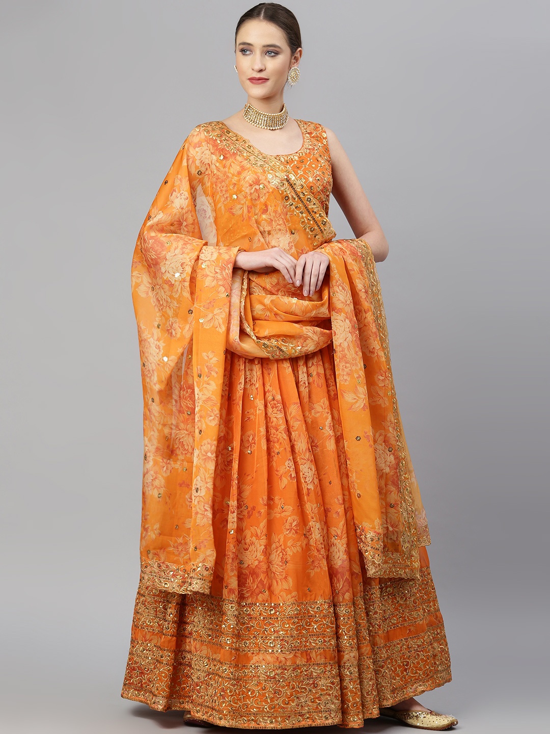 

Readiprint Fashions Orange & Gold-Toned Embellished Sequinned Semi-Stitched Lehenga & Unstitched Blouse With