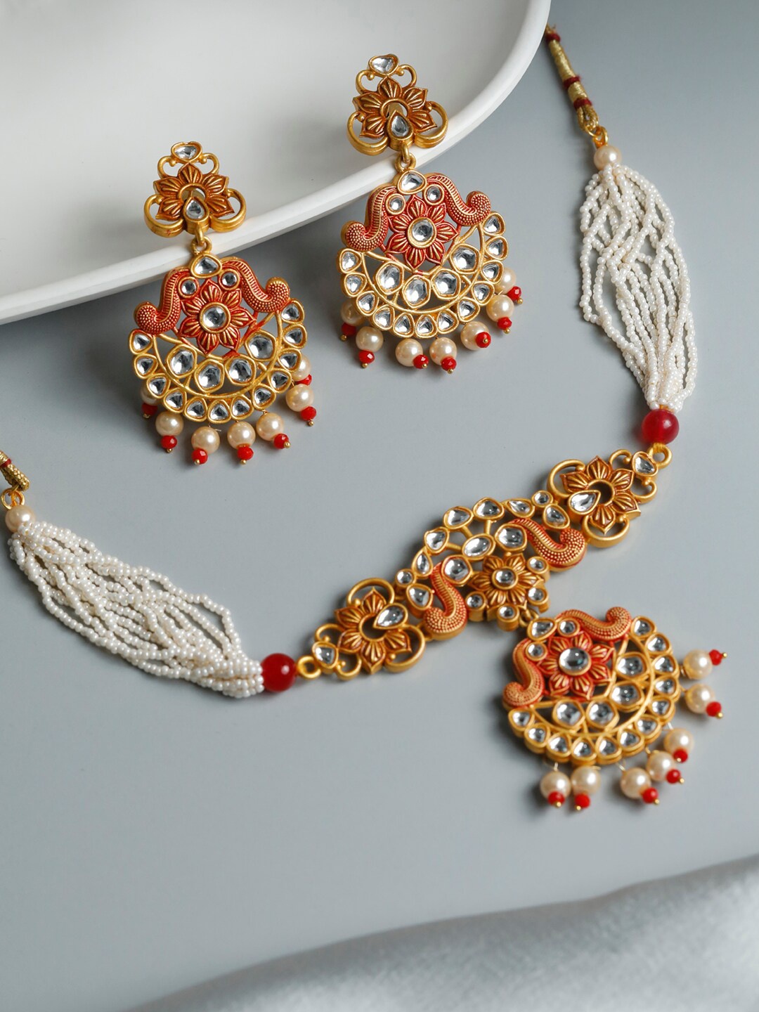 

Priyaasi Gold-Plated White Stone Studded & Beaded Jewellery Set