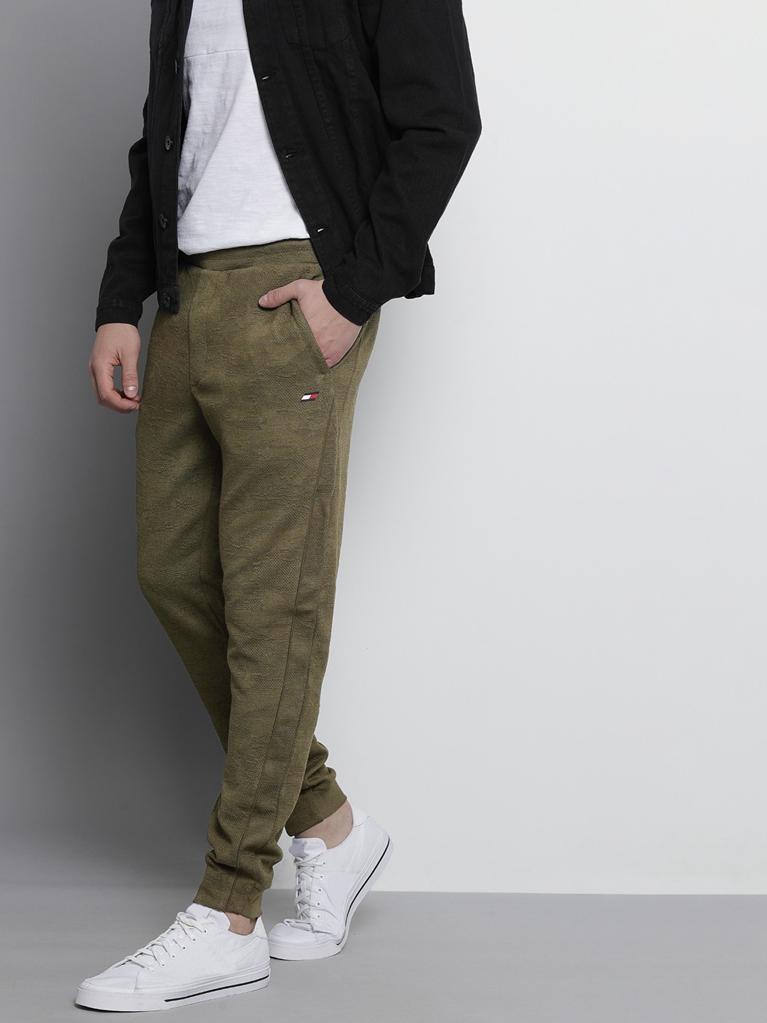 

Tommy Hilfiger Men Olive Green Self Designed Mid Rise Casual Track pants