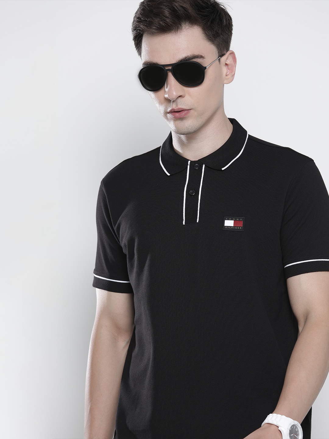 

Tommy Hilfiger Men Black Solid Polo Collar Casual T-shirt