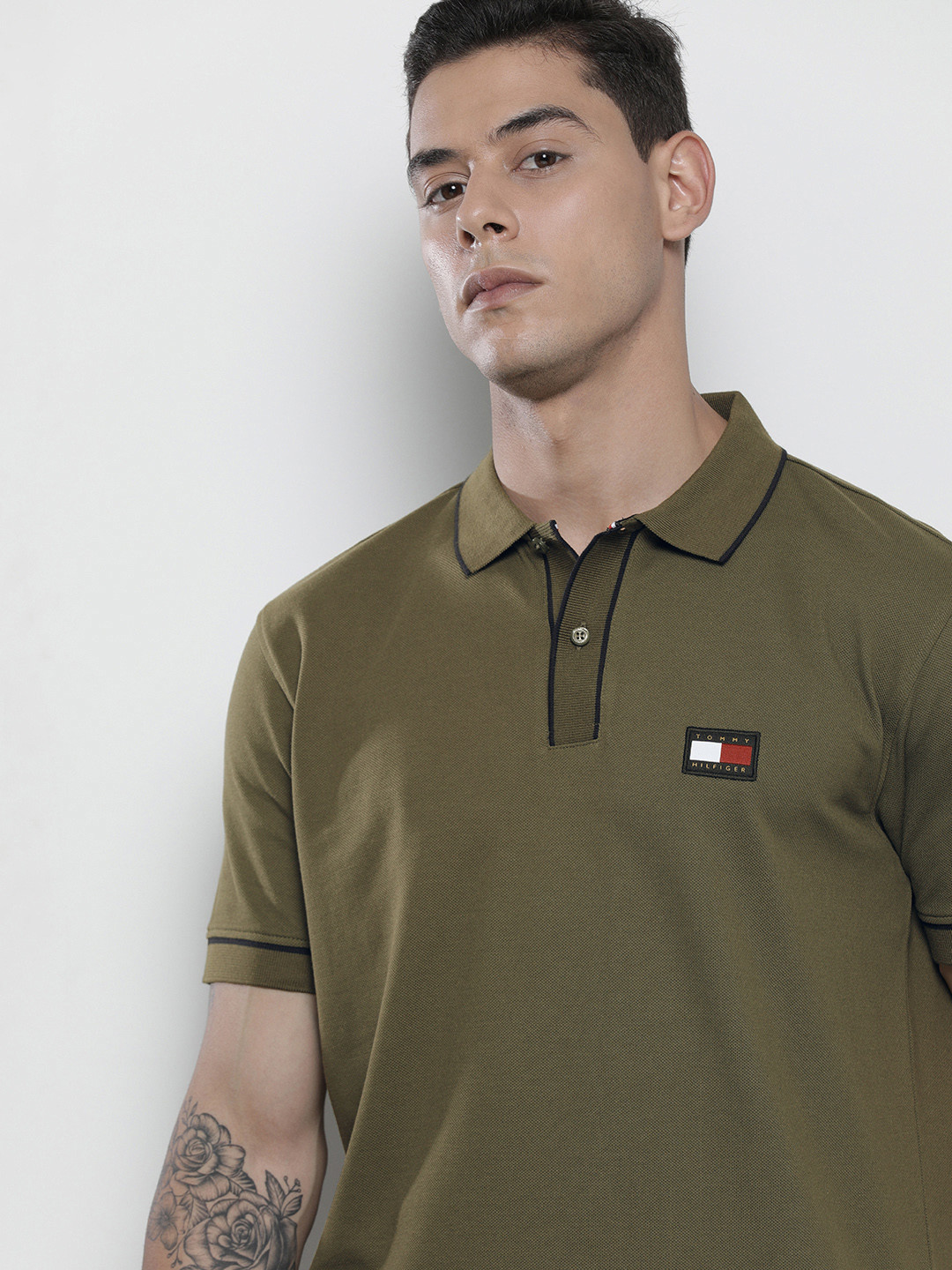 

Tommy Hilfiger Men Olive Green Solid Polo Collar Brand Logo Applique Regular Fit T-shirt