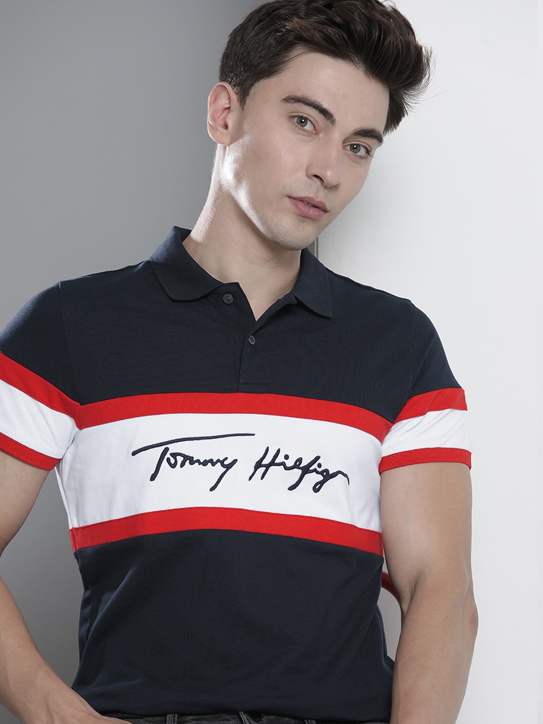 

Tommy Hilfiger Men Navy Blue & White Striped Polo Collar Slim Fit T-shirt